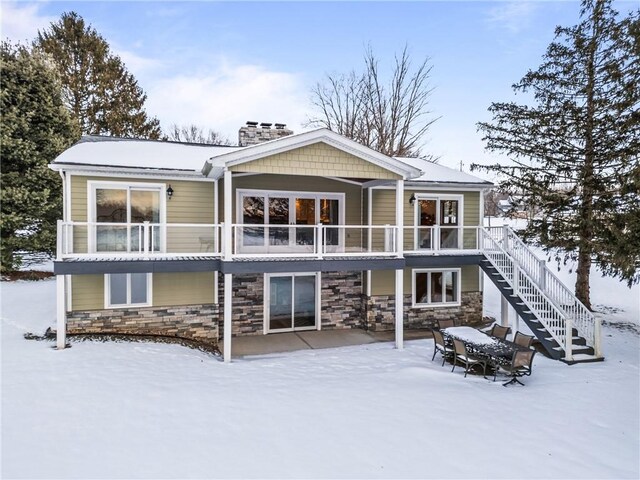 view of snow covered house