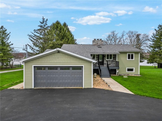 252 Latonka Dr, Jackson Twp Mer, PA 16137 - view of front of property featuring stairway, a detached garage, a chimney, a front lawn, and roof with shingles