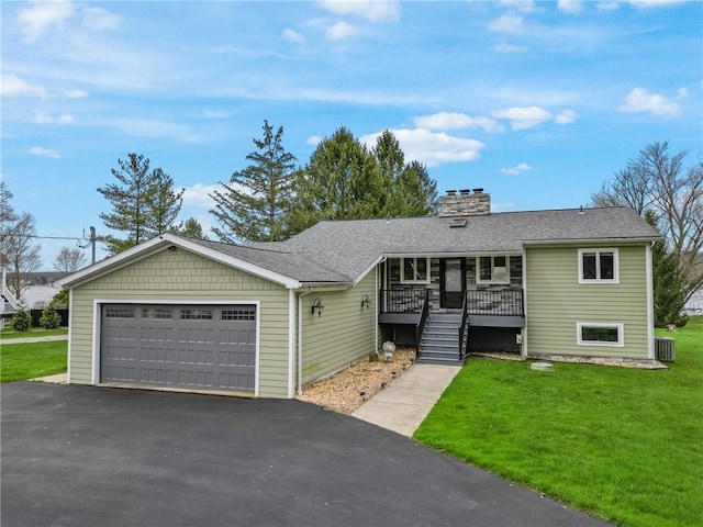 252 Latonka Dr, Jackson Twp Mer, PA 16137 - single story home featuring roof with shingles, a front lawn, a porch, a chimney, and aphalt driveway