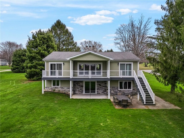 252 Latonka Dr, Jackson Twp Mer, PA 16137 - back of house featuring stone siding, a chimney, a patio area, a lawn, and stairs