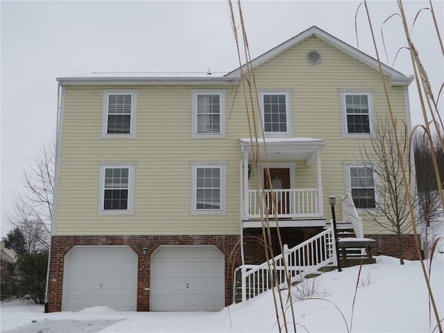 view of front of house with a porch and a garage