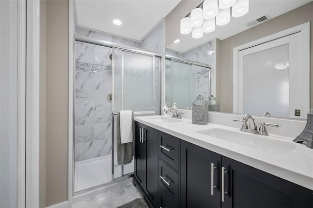 bathroom featuring an enclosed shower and vanity