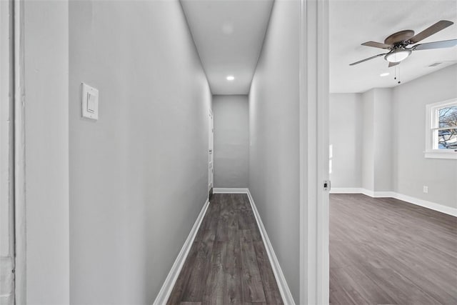 corridor with dark wood-type flooring