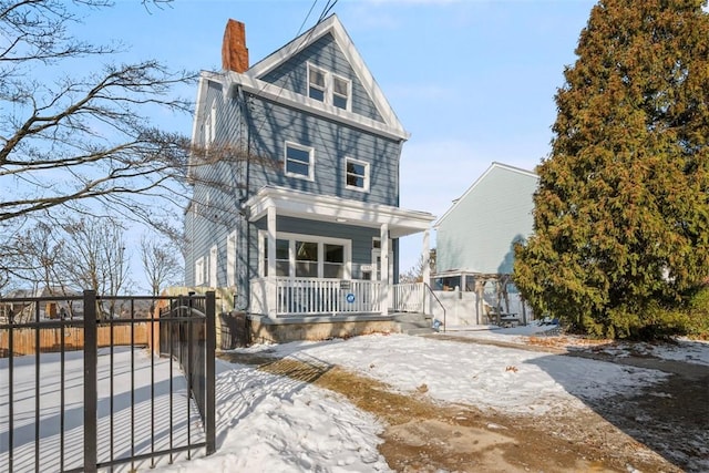 front of property featuring covered porch