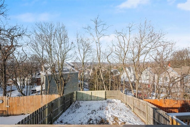 view of yard covered in snow