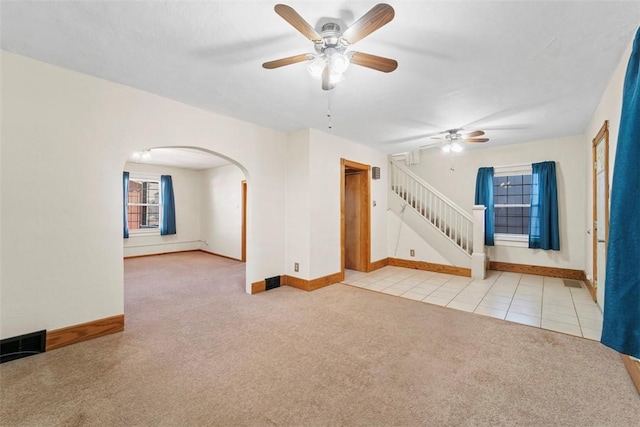 spare room with light carpet and ceiling fan