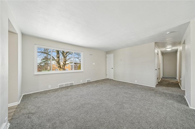 unfurnished room featuring carpet floors