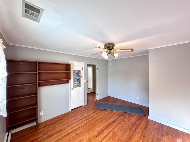 interior space featuring ornamental molding, ceiling fan, and light hardwood / wood-style flooring