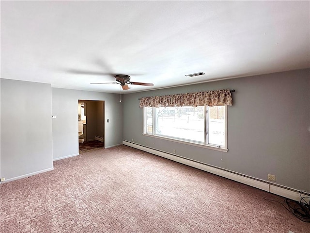 carpeted empty room featuring ceiling fan and baseboard heating