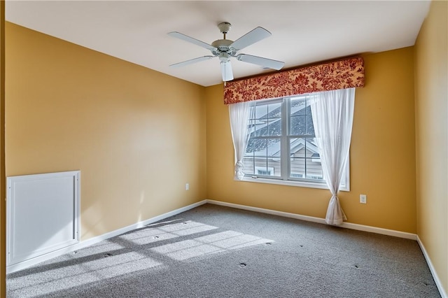 empty room with carpet floors and ceiling fan