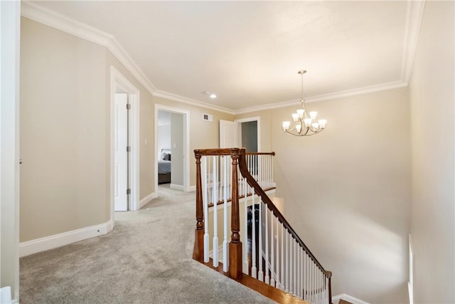 corridor with crown molding, light carpet, and a chandelier