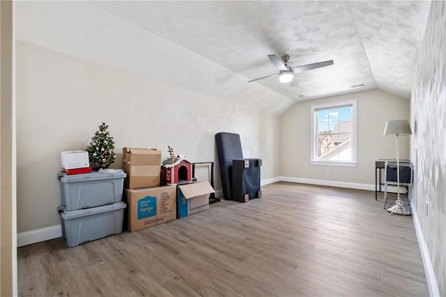 bonus room featuring wood-type flooring, lofted ceiling, and ceiling fan