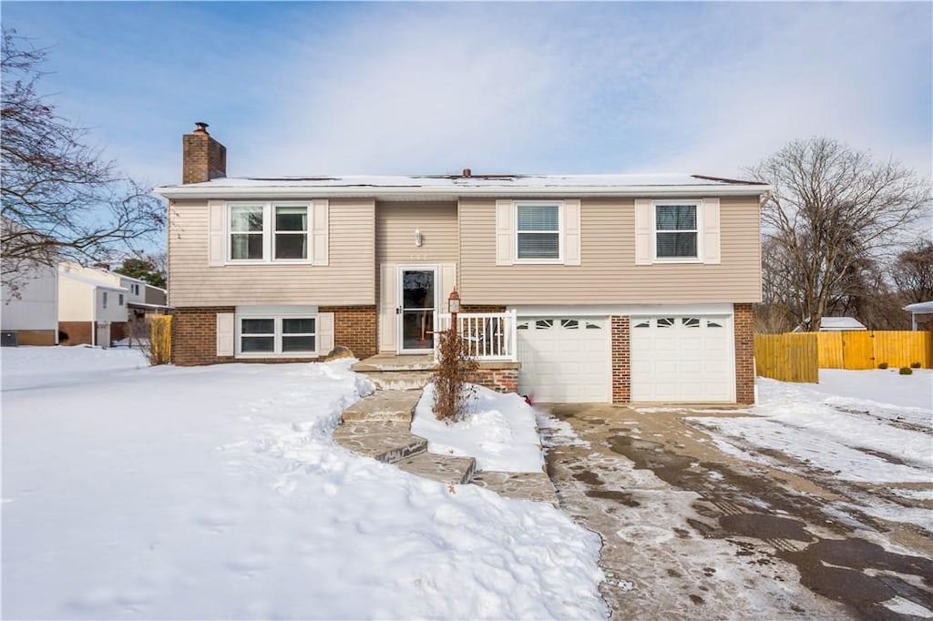 bi-level home featuring a garage