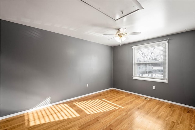 empty room with hardwood / wood-style floors