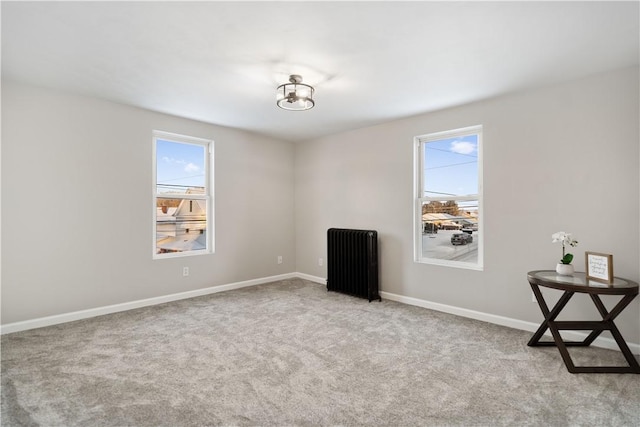 carpeted spare room with radiator