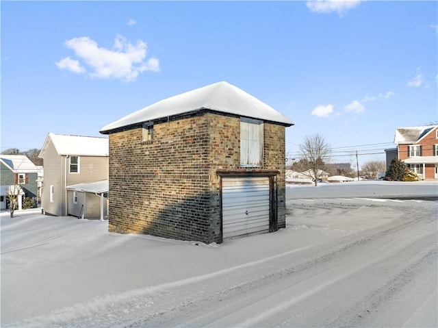 view of side of home featuring a garage