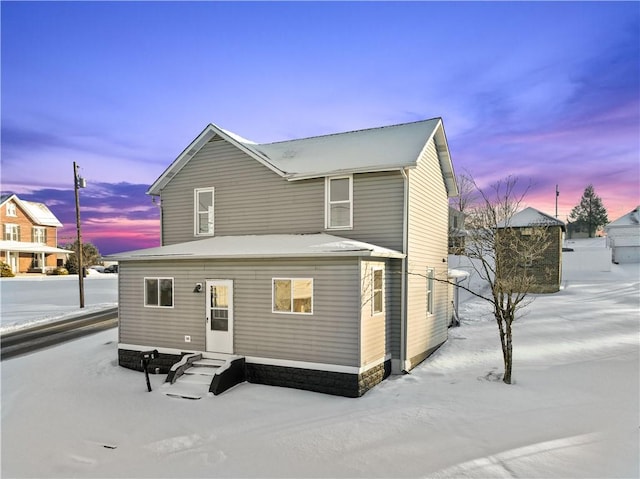 view of snow covered house