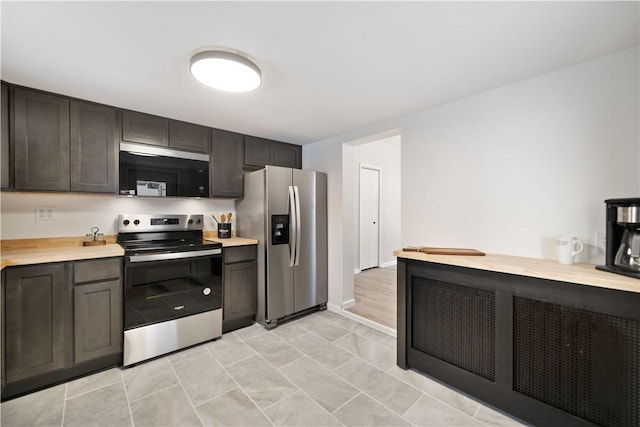 kitchen with dark brown cabinetry and stainless steel appliances