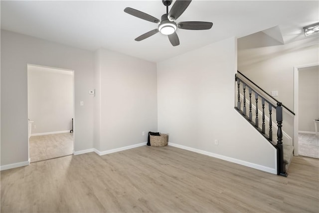 unfurnished living room featuring light hardwood / wood-style flooring and ceiling fan