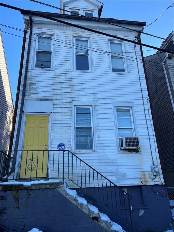 view of front of home featuring cooling unit