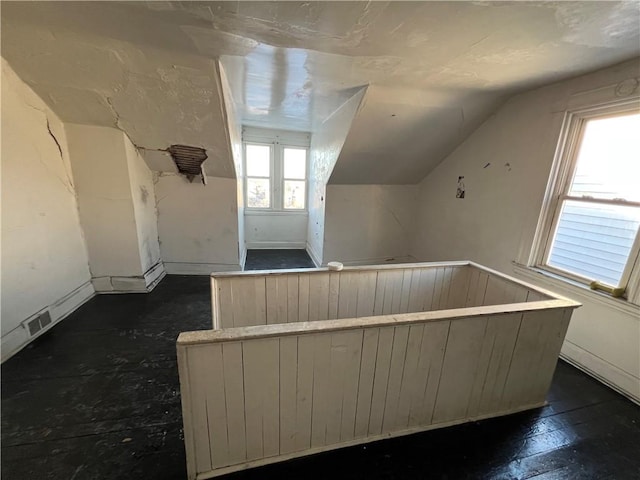 bonus room with vaulted ceiling