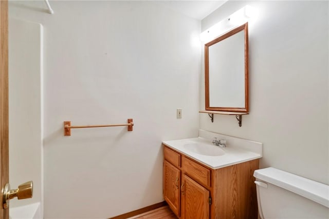 bathroom featuring vanity and toilet