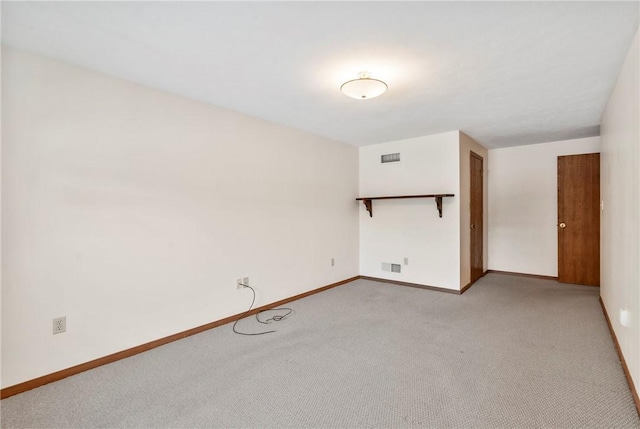 spare room with light carpet