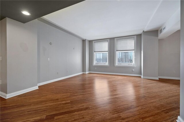 unfurnished room featuring wood-type flooring