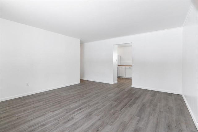 unfurnished room featuring dark wood-type flooring