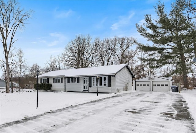 view of front facade with an outbuilding and a garage