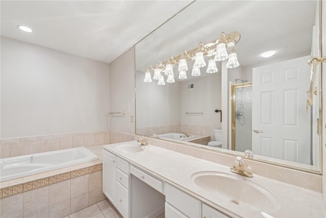 full bathroom featuring tile patterned flooring, vanity, independent shower and bath, and toilet