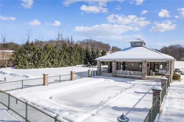 snowy yard featuring a porch