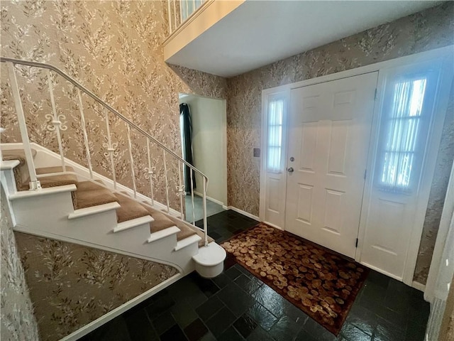 foyer entrance featuring plenty of natural light