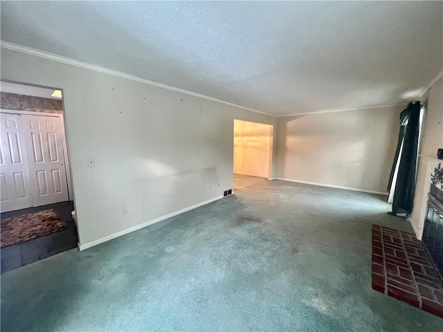 unfurnished living room with a brick fireplace, ornamental molding, and dark colored carpet