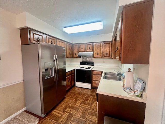 kitchen featuring range with electric cooktop, sink, a textured ceiling, and stainless steel fridge with ice dispenser