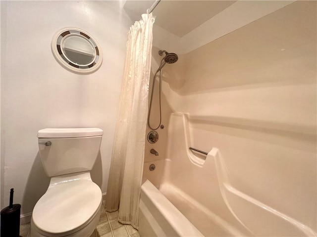 bathroom with tile patterned flooring, shower / bath combo, and toilet