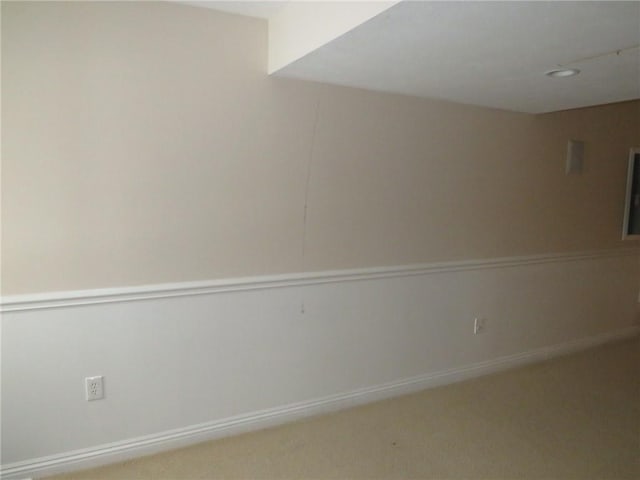 unfurnished room with carpet flooring