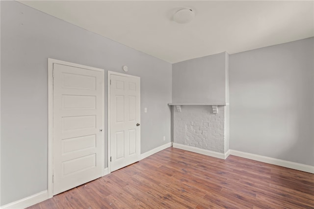 spare room with hardwood / wood-style floors