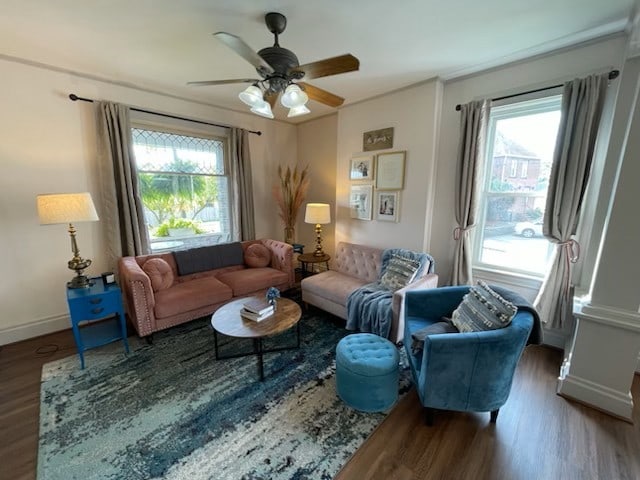 sitting room with ceiling fan and dark hardwood / wood-style flooring