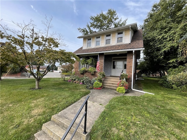 view of front of house featuring a porch and a front lawn