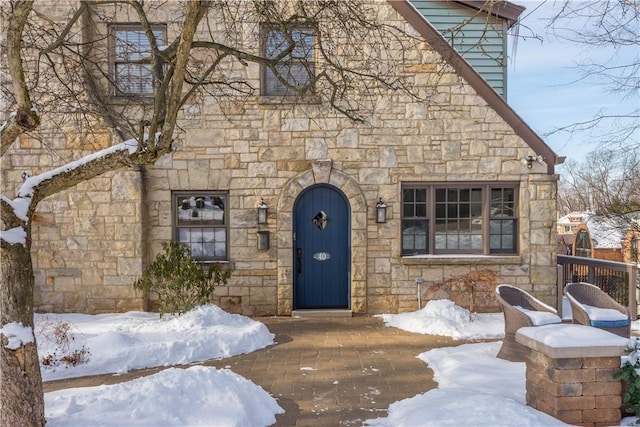 view of snow covered property entrance