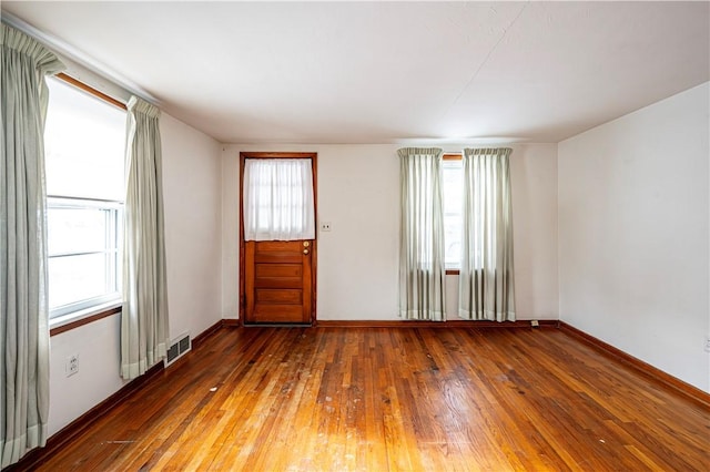 interior space with dark hardwood / wood-style flooring