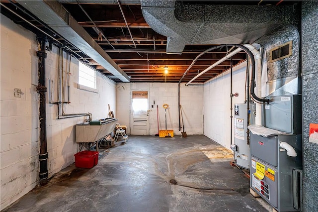 basement with sink and gas water heater