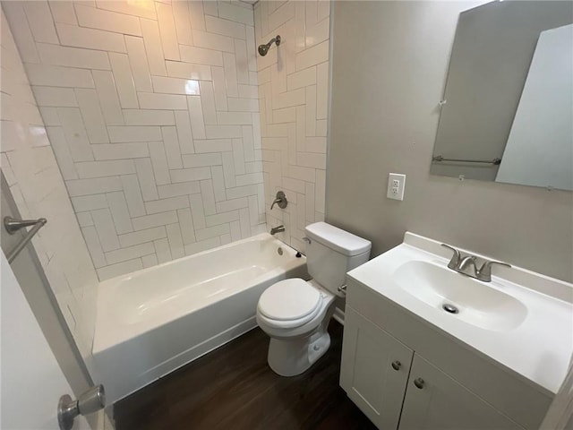 full bathroom featuring vanity, toilet, tiled shower / bath combo, and hardwood / wood-style floors