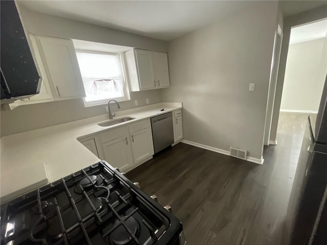 kitchen with gas stove, sink, white cabinetry, dark hardwood / wood-style flooring, and dishwasher