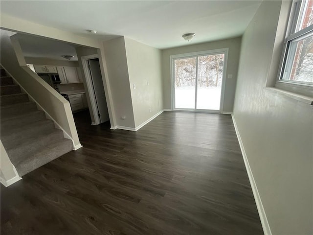 spare room with dark hardwood / wood-style flooring