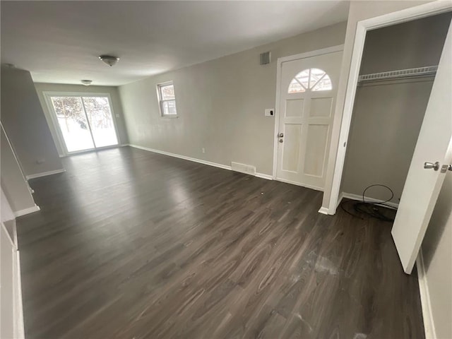 foyer entrance featuring dark hardwood / wood-style floors