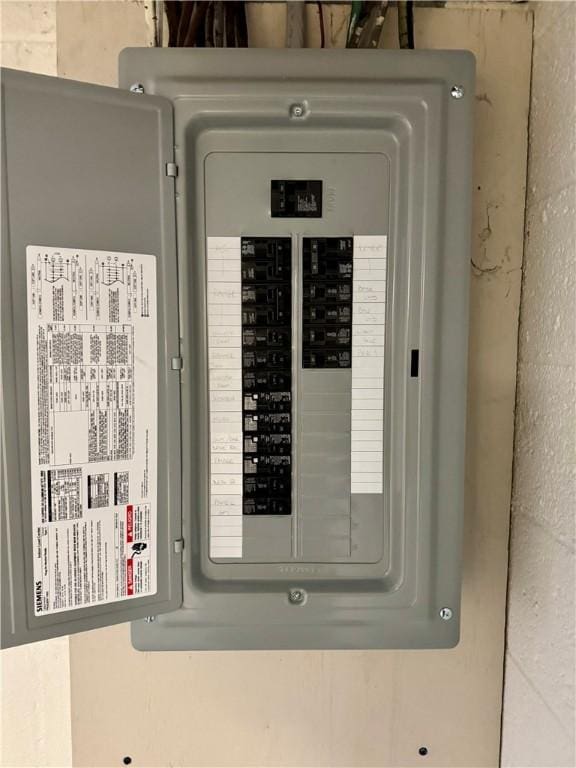 utility room featuring electric panel