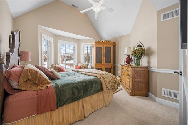 carpeted bedroom featuring ceiling fan and vaulted ceiling