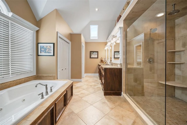 bathroom with vanity, plus walk in shower, tile patterned flooring, and vaulted ceiling